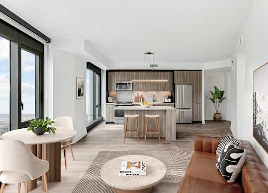 A modern living room with a brown leather couch and a coffee table.