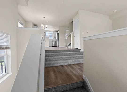 Grey carpeted staircase at The Townhomes at Pine Drive, Colorado
