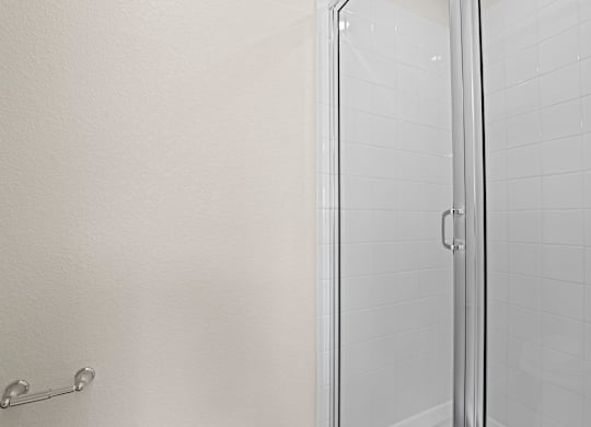 Modern bathroom with a glass shower door at The Townhomes at Pine Drive, Parker, Colorado