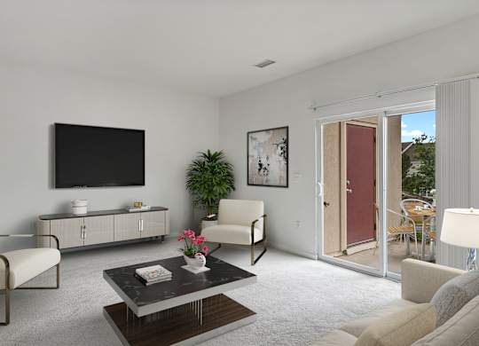 A living room with a flat screen TV mounted on the wall.