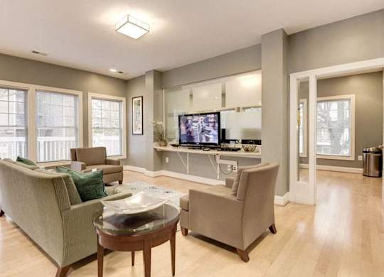 A living room with a couch, chair, and coffee table.