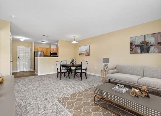 A living room with a grey sofa and a coffee table.
