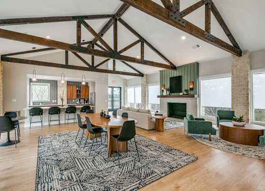 a large living room with a dining room table and a fireplace at Canyon Ridge, Texas