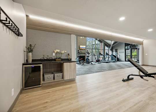 a gym with a desk and a chair in the middle of a room