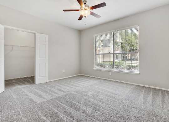 Carrington Park Apartments in Plano, TX with Wall to Wall Carpet, Walk-In Closet, Gray Walls, Large Window