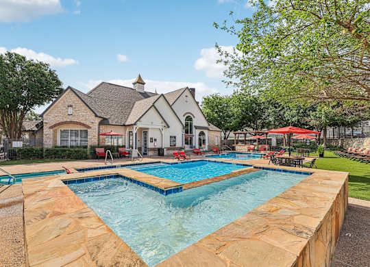 A large house with a pool in the backyard.