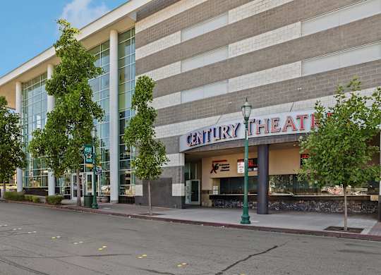 Century Theatre is a large building with a lot of windows.