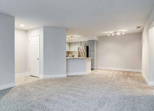Apartments in Roswell, GA for rent - 2200 Big Creek Apartments - Living room area with ample space and plush carpet