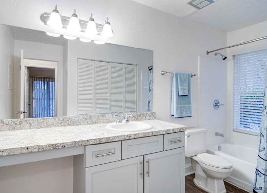Apartments in Roswell, GA for rent - 2200 Big Creek Apartments - Large Luxury Bathroom with counter space, cabinets for storage, and a large vanity