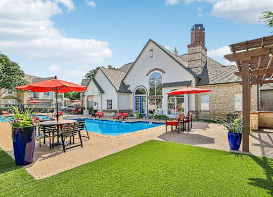 A house with a pool and a patio area.