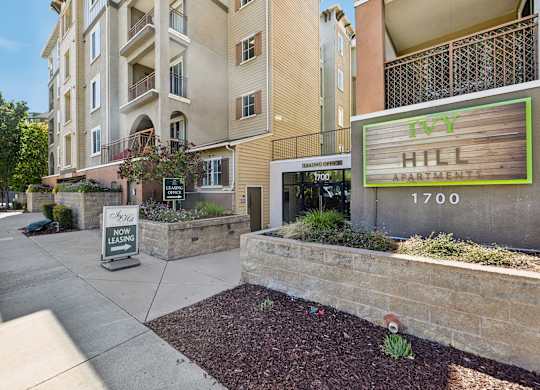A sign for the 1700 apartment building is displayed.