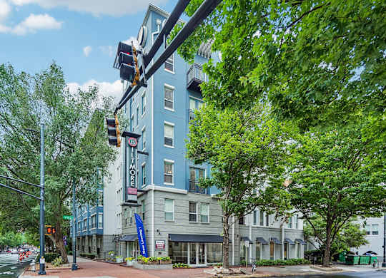 A street view with a traffic light and a building with a sign that says