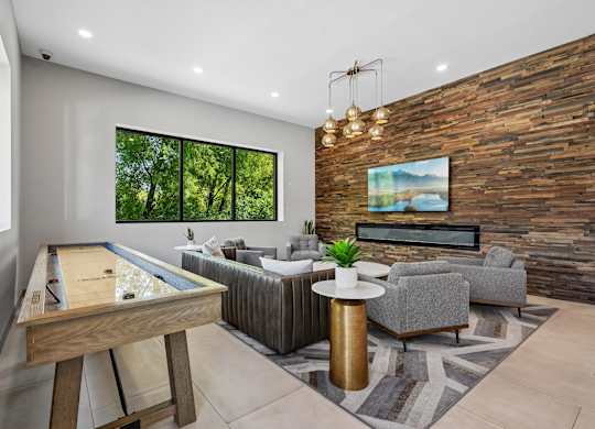 A room with a pool table and a couch.
