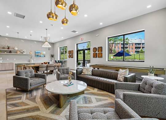 A modern living room with grey and gold furniture.