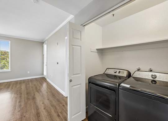 A laundry room with a washer and dryer.