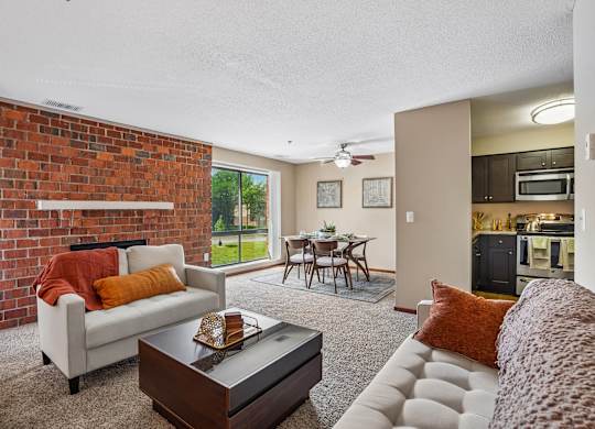 A living room with a white couch and a coffee table.
