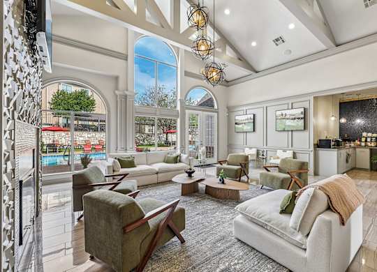 A living room with a white couch and a television.