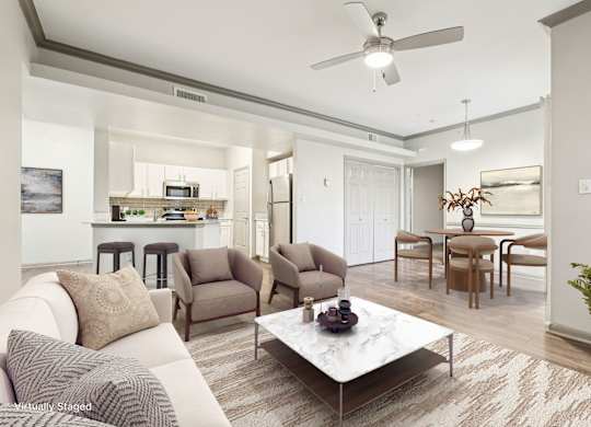 A living room with a white couch and a coffee table.