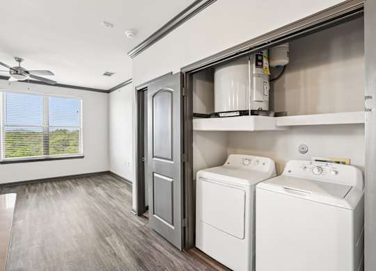 A laundry room with a washer and dryer.