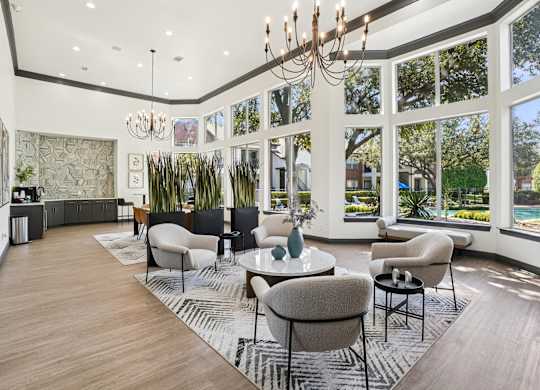 A large room with a lot of windows and a chandelier.