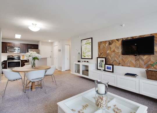 a living room with a table and a television