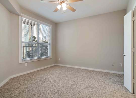 Atlanta, GA Apartments - Biltmore at Midtown -Bedroom with Large Windows