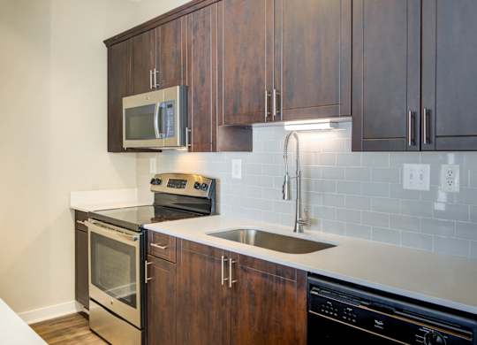 Atlanta, GA Apartments - Biltmore at Midtown - Luxury Kithcne with Stainless Steel Appliances