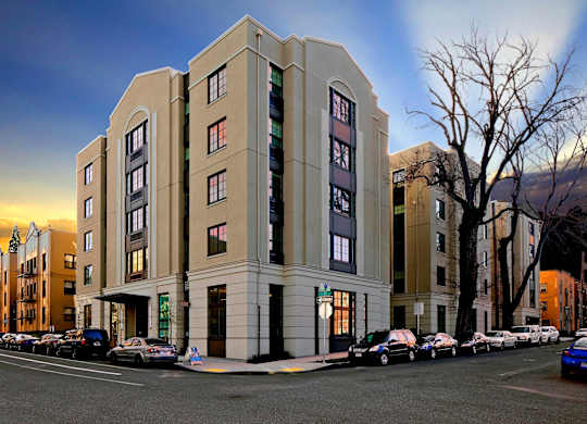 A large building with a parking lot in front of it.