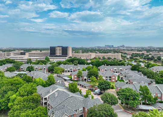 an aerial view of a neighborhood with houses and trees