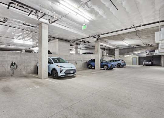 parking spaces in a parking garage with cars