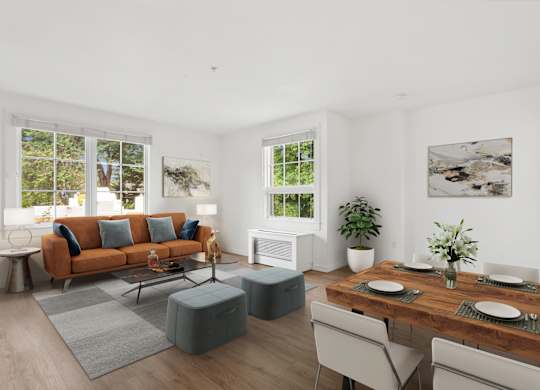 a living room with a couch and a table and chairs