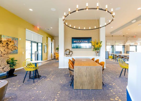 a dining room with a table and chairs in a lobby