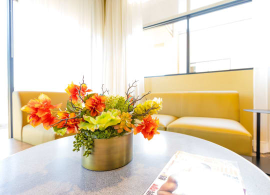 a vase of flowers on a table in a room