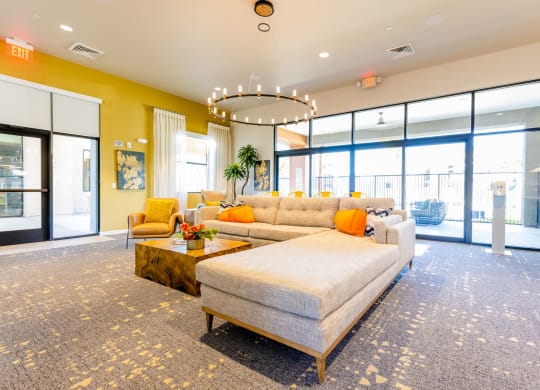 a large living room with a couch and a coffee table