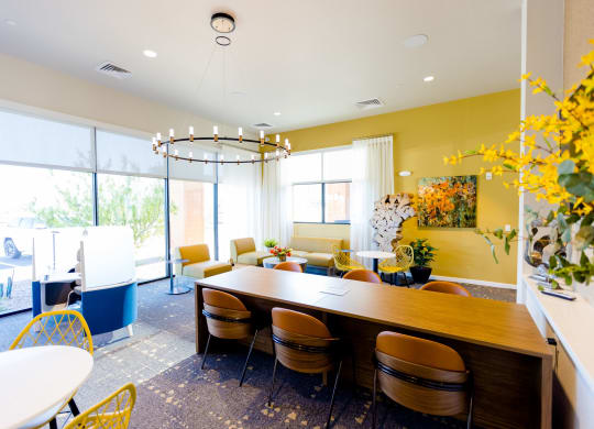 a dining room with a long wooden table and chairs