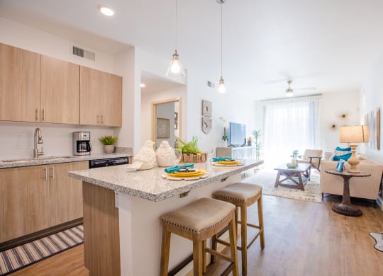 an open floor plan with a kitchen and living room
