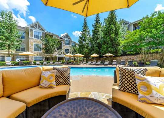 Alpharetta Apartments – The Ascent at Windward – sundeck area with seating and umbrellas