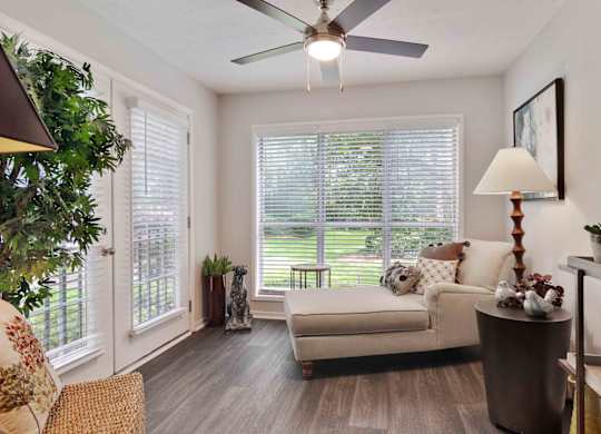 Glen Lake Apartments in Atlanta, GA 30328 photo of a sun room with ceiling fan