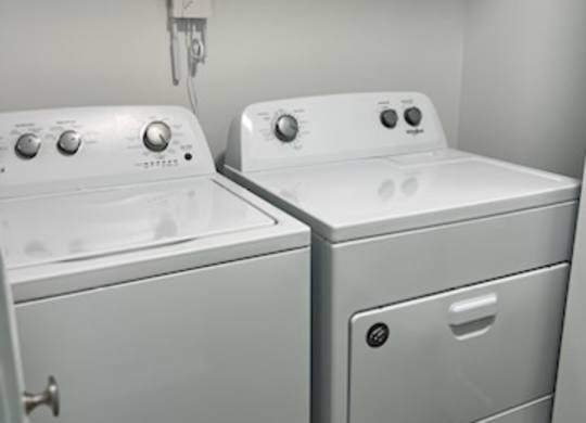 a white washer and dryer sitting next to each other