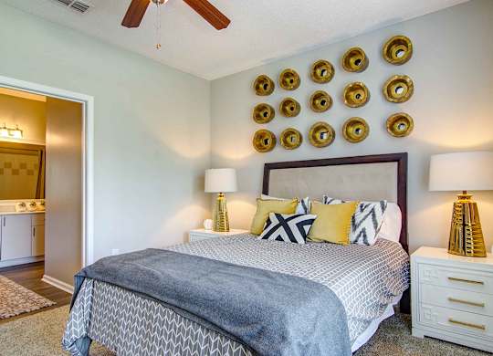 Alpharetta Apartments – The Ascent at Windward – master bedroom with plush carpeting and ceiling fan