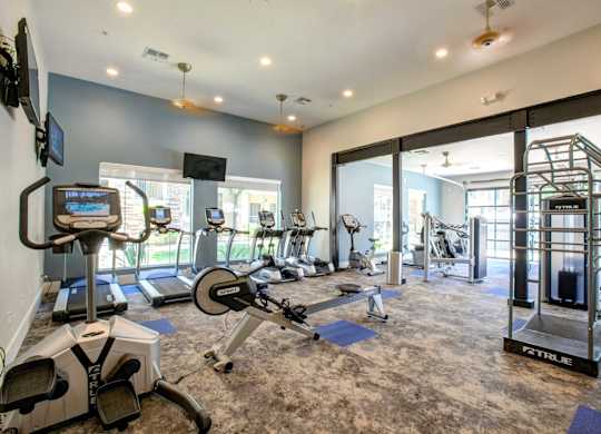 Phoenix, AZ Apartments for Rent - Ironhorse at Tramonto - Fitness Center With Exercise Bikes, Weights Machines, and More