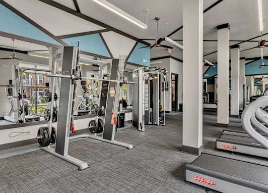 Pet-Friendly Apartments in Nashville, TN- Octave Apartments- state of the art fitness center with squat racks machines and cardio equipment