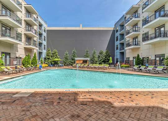Pet-Friendly Apartments in Nashville, TN- Octave Apartments- resort style swimming pool with sundeck and lounge chairs