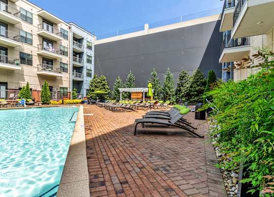 Pet-Friendly Apartments in Nashville, TN- Octave Apartments- resort style swimming pool with sundeck and lounge chairs