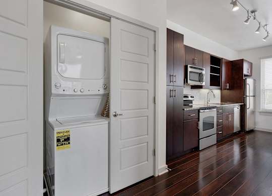 12 South Apartments - Nashville TN - kitchen with dark wood cabinets and stainless steel appliances