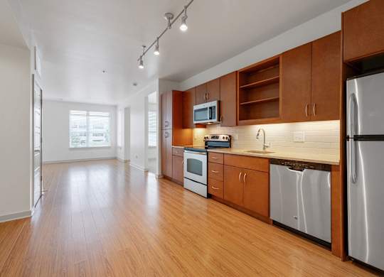 12 South Apartments - Nashville TN - kitchen with dark wood cabinets and stainless steel appliances