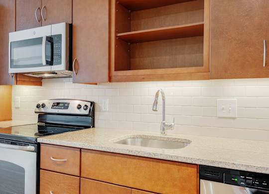 a kitchen with a sink and a microwave