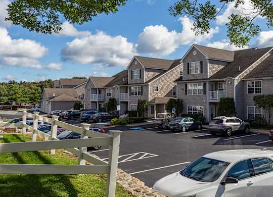 Orchards Apartments Marlborough ma apartment loft style apartments photo of apartment building exteriors with tan siding next to parking lot and landscaping