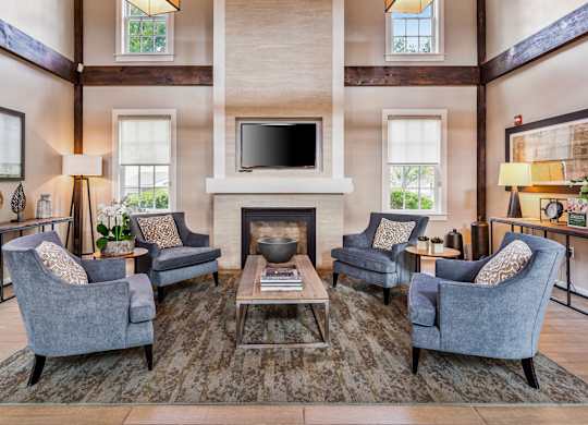 Orchards Apartments Marlborough ma apartment loft style apartments photo of  clubhouse lounge area with large fireplace and mantle with high ceiling and modern furniture