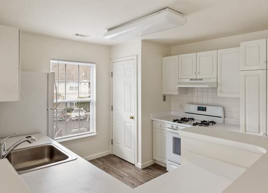 Orchards Apartments Marlborough ma apartment loft style apartments photo of kitchen with white appliances and white cabinets with wood floors and large window